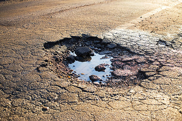 road-damage-pot-hole.jpg