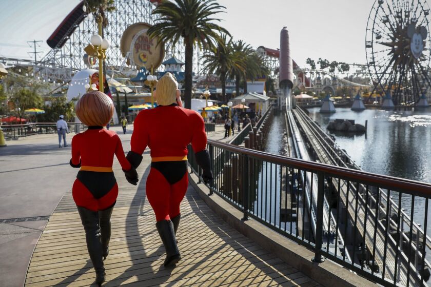 ANAHEIM,CA --THURSDAY, JUNE 21, 2018--Mr. Incredible and Elastigirl, from Pixar's Incredibles franchise, during a press preview of Pixar Pier at Disney California Adventure Park, in Anaheim, CA, June 21, 2018. (Jay L. Clendenin / Los Angeles Times)